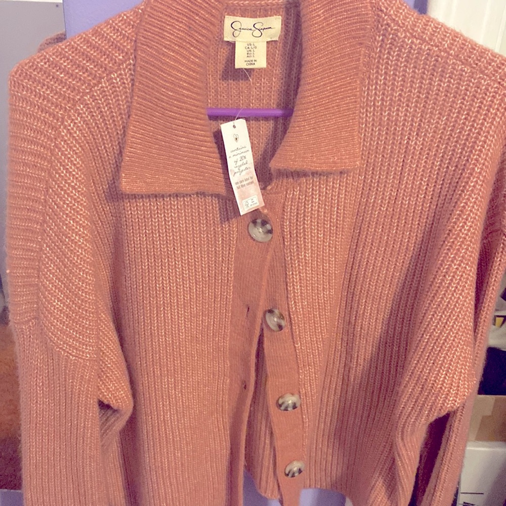 Fuzzy cardigan with buttons the color is like a coral pink